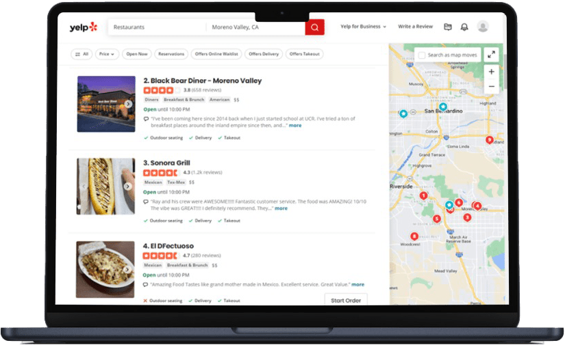 A laptop screen displaying Yelp search results for restaurants in Moreno Valley, CA, with a list of eateries, their ratings, and a map on the right side.