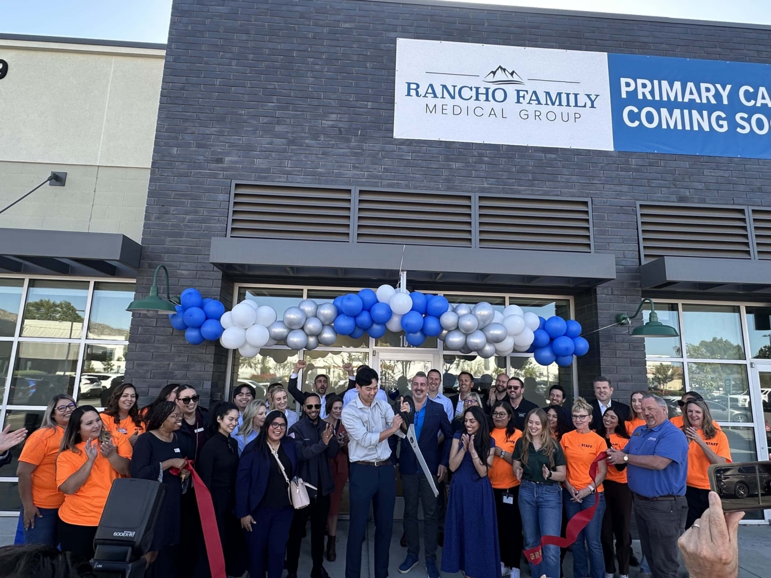 Community ribbon-cutting event at Rancho Family Medical Group in Moreno Valley, celebrating new healthcare facilities and local economic growth.