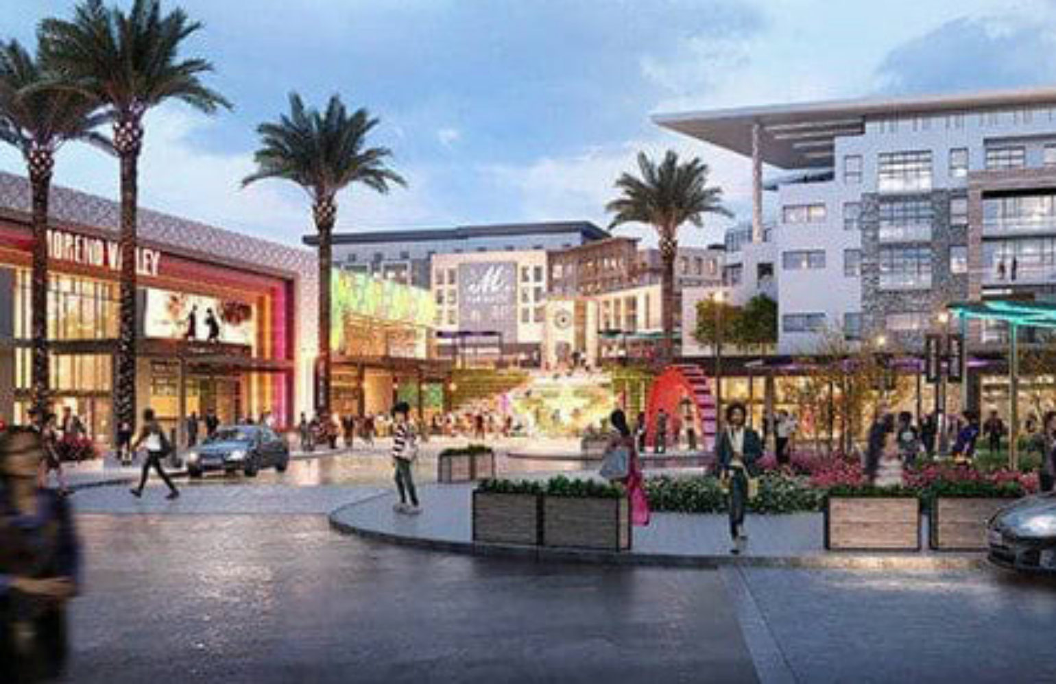 A vibrant urban shopping and entertainment district in Moreno Valley featuring modern buildings, palm trees, and pedestrians enjoying a lively community atmosphere.